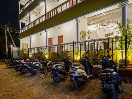 Parking area with vehicles parked in front of it - Le Poshe Beachview Pondicherry
