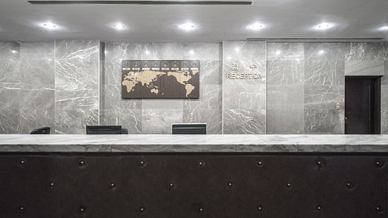Hotel lobby and front desk brightly lit and well decorated1
