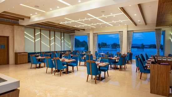Seating arrangements inside the restaurant - The Orchid Hotel, Jamnagar
