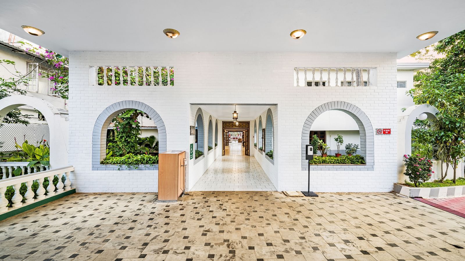 An image of the exterior view if the lobby at GReaT Trails River View Resort Thanjavur By GRT Hotels with greenery around