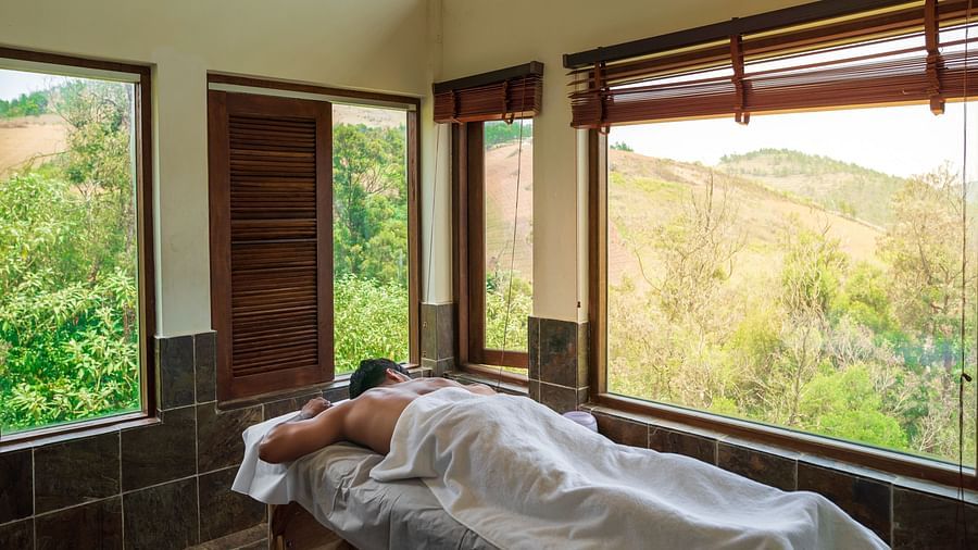 person on a table at unwind spa