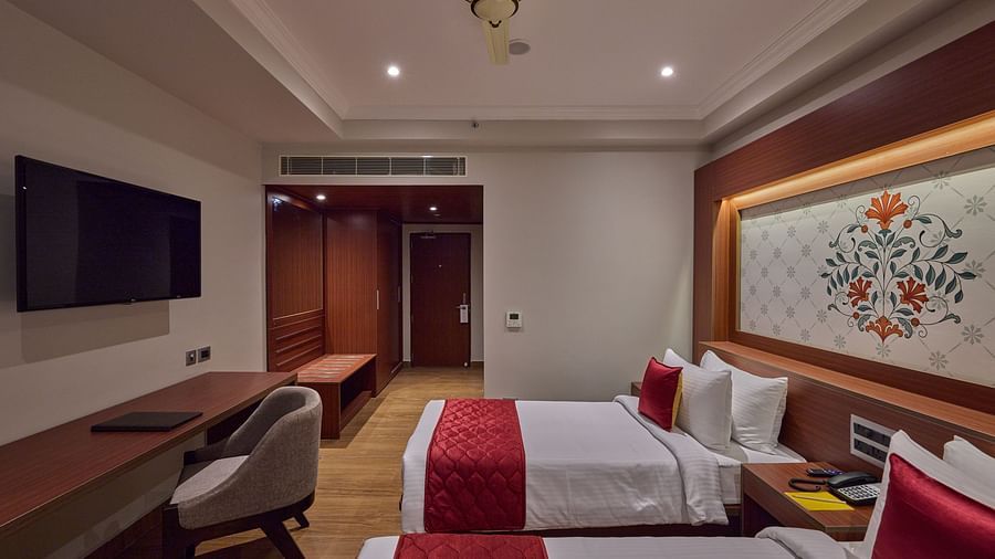 twin beds offered at the deluxe room facing the TV - Golden Tulip, Tirupati  1
