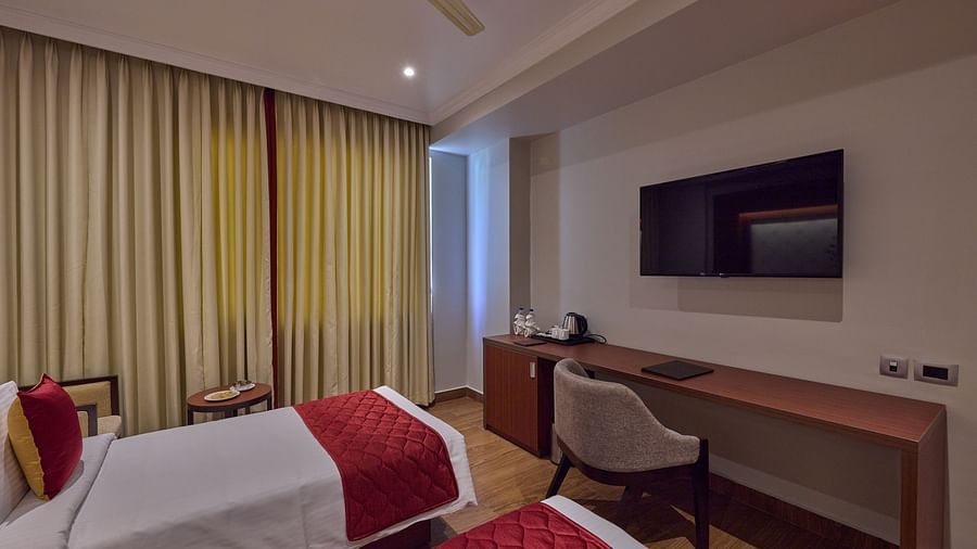 twin beds offered at the deluxe room facing the TV - Golden Tulip, Tirupati  3