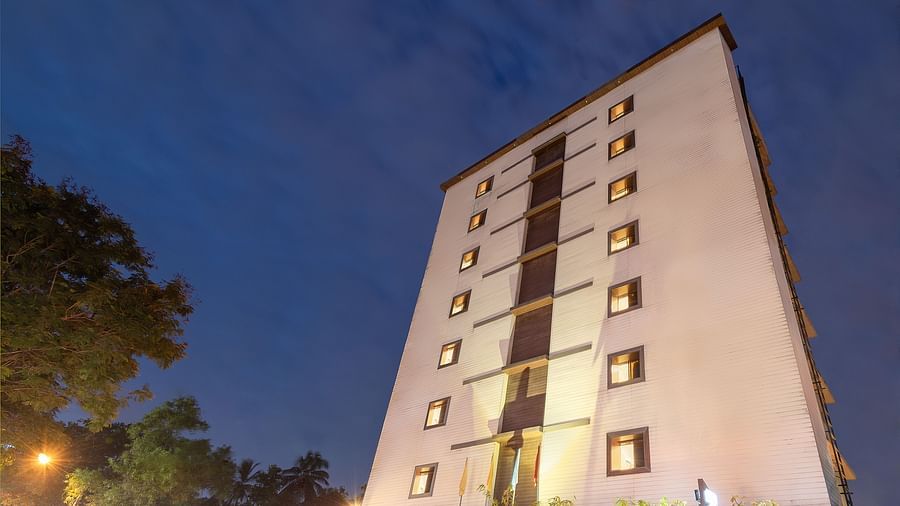 Facade view of Oriental Aster, Mumbai, against night sky.