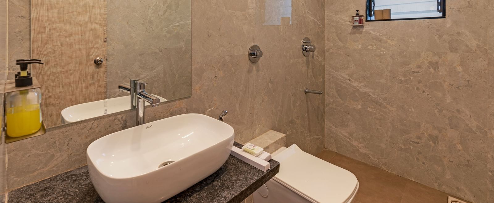Bathroom at Emerald Retreat, Tungarli featuring a clean, minimalist design with overhead shower and vanity mirror.