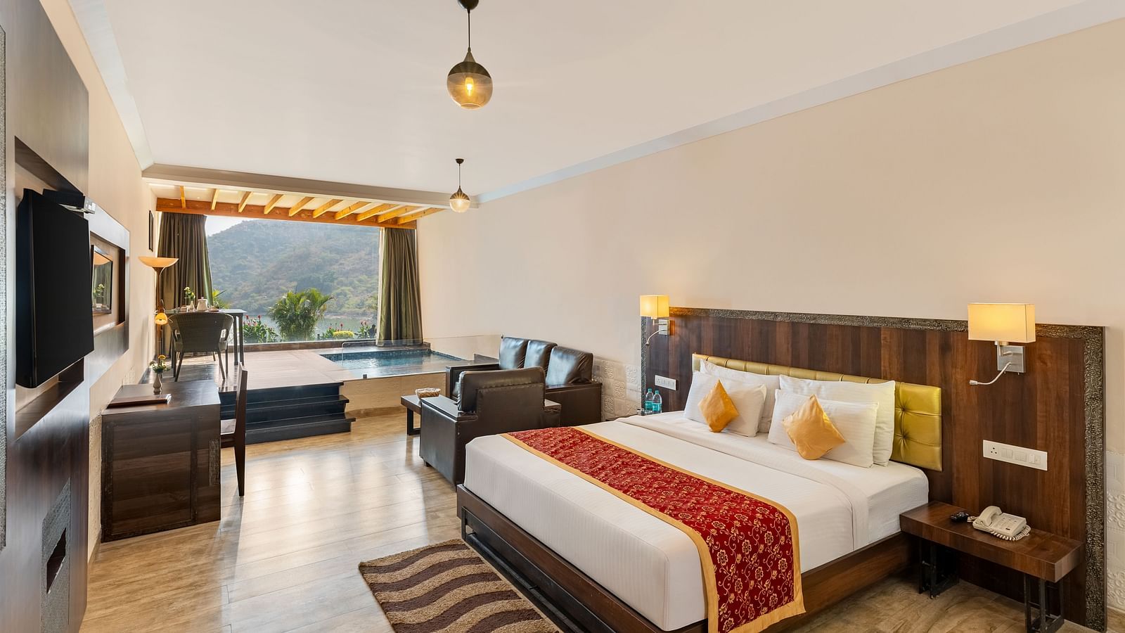Hotel room with a bed annd a patterned runner on it with a scenic view - Via Lakhela Resort & Spa, Kumbhalgarh