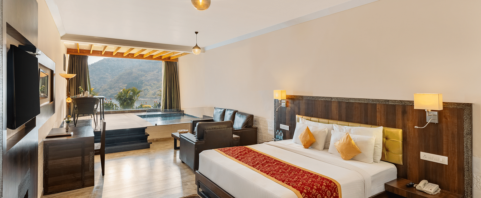 Hotel room with a bed annd a patterned runner on it with a scenic view - Via Lakhela Resort & Spa, Kumbhalgarh