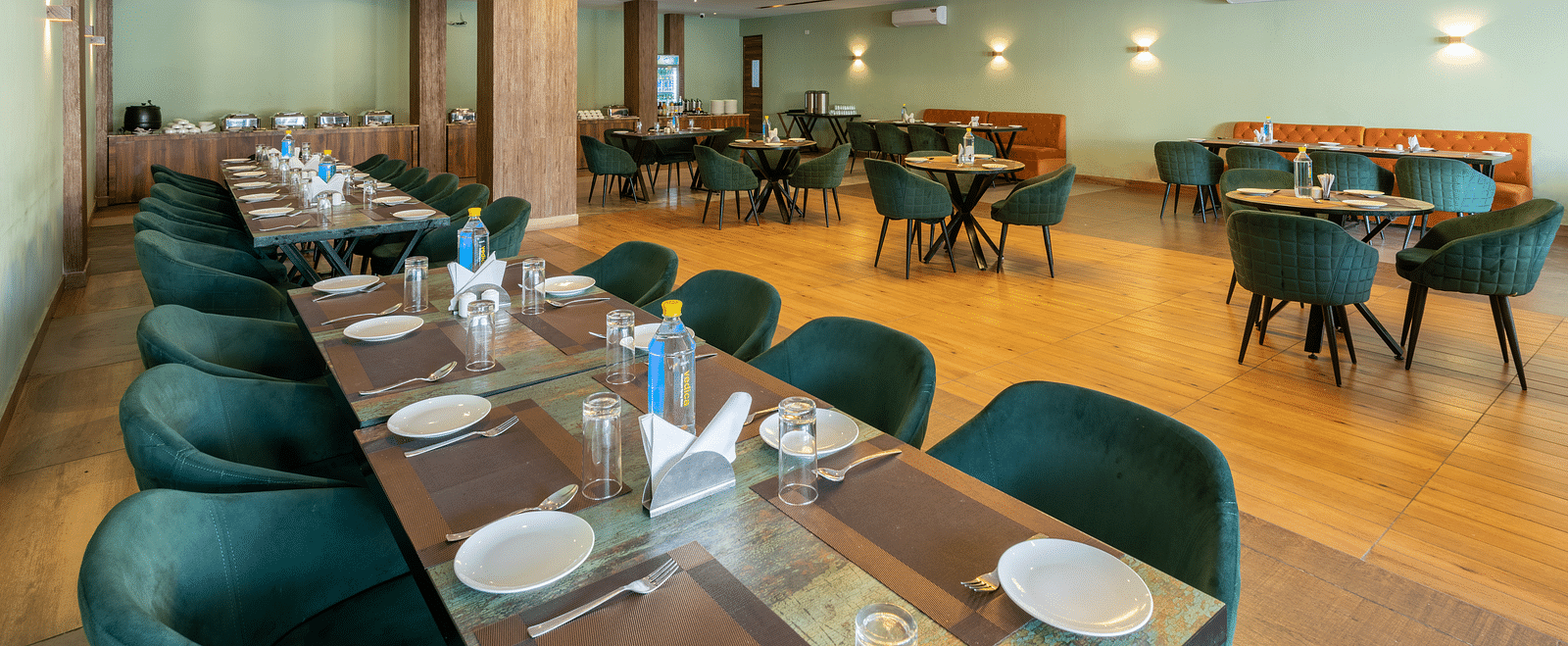 A shot of the restaurant taken from above a chairs and table laid out with cutlery - DLS Ganga Bliss, Haridwar