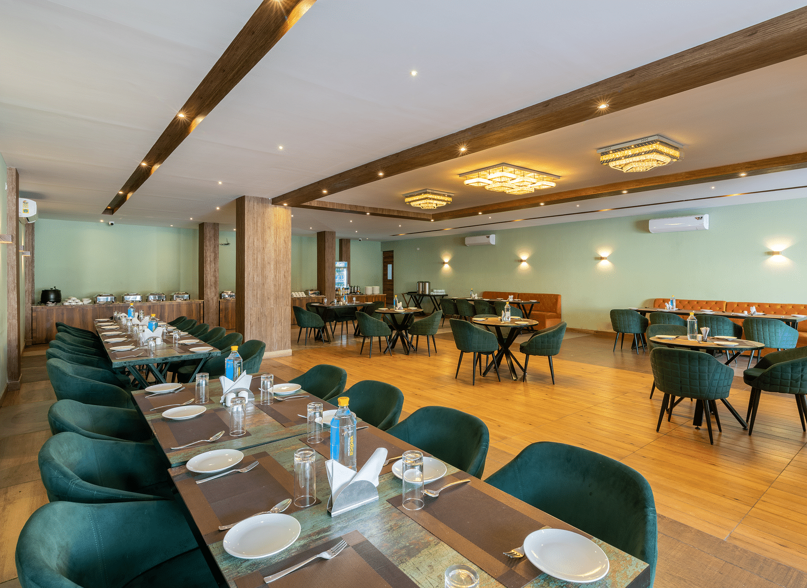 A shot of the restaurant taken from above a chairs and table laid out with cutlery - DLS Ganga Bliss, Haridwar