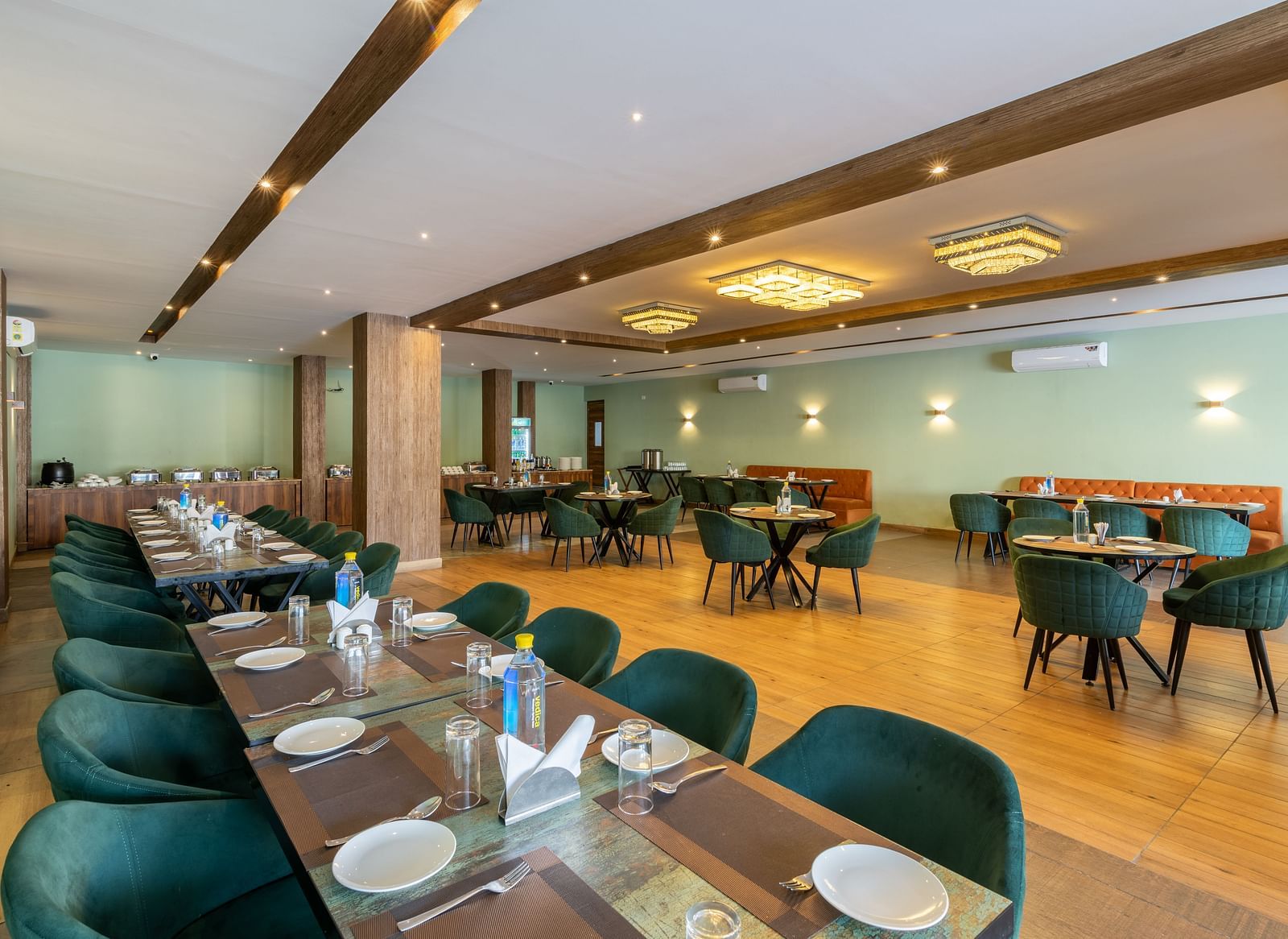 A shot of the restaurant taken from above a chairs and table laid out with cutlery - DLS Ganga Bliss, Haridwar