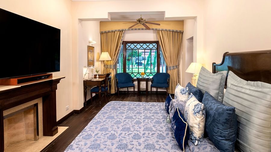 image of the Claridges room with a window at the end of the room at The Claridges Nabha Residence