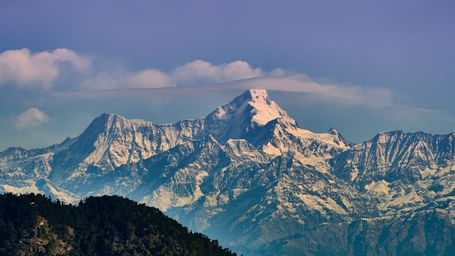 A panoramic view of the Himalayan range with pink hue filled sky