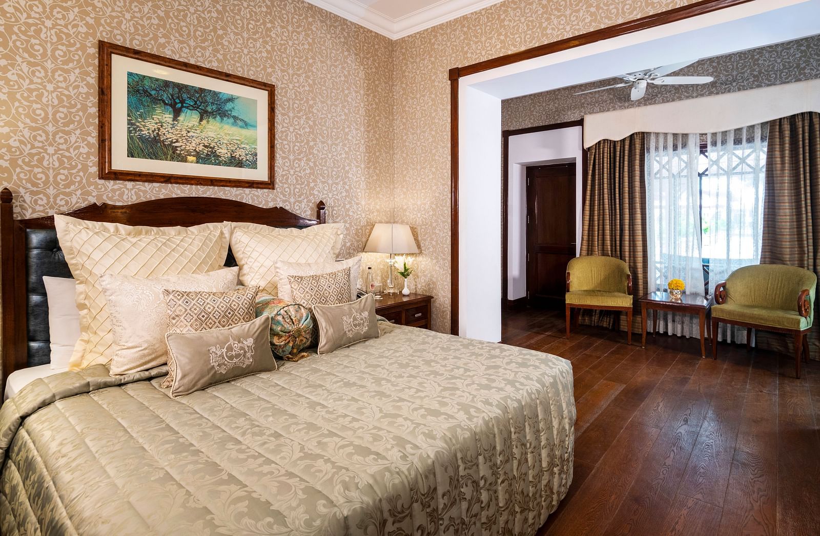 full view of the club room exposing the bed and the seating area at The Claridges Nabha Residence