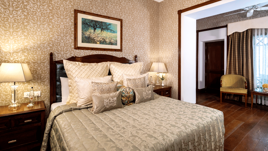 image of the king size bed at the Club Rooms at The Claridges Nabha Residence