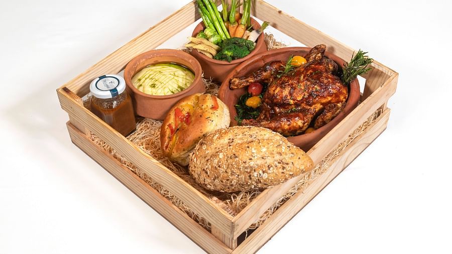 a filling platter of indian food served by the tiffin by claridges - The Claridges New Delhi