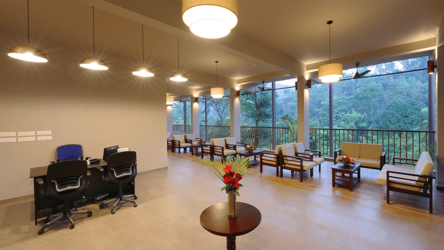 A restaurant interior features tables and pendant lights, ready for dining.