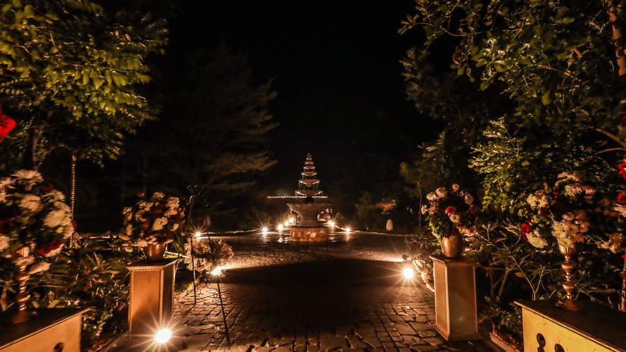 An outdoor pathway leading to a decorated entrance with lighting at Ananta Spa and Resort, Jaipur