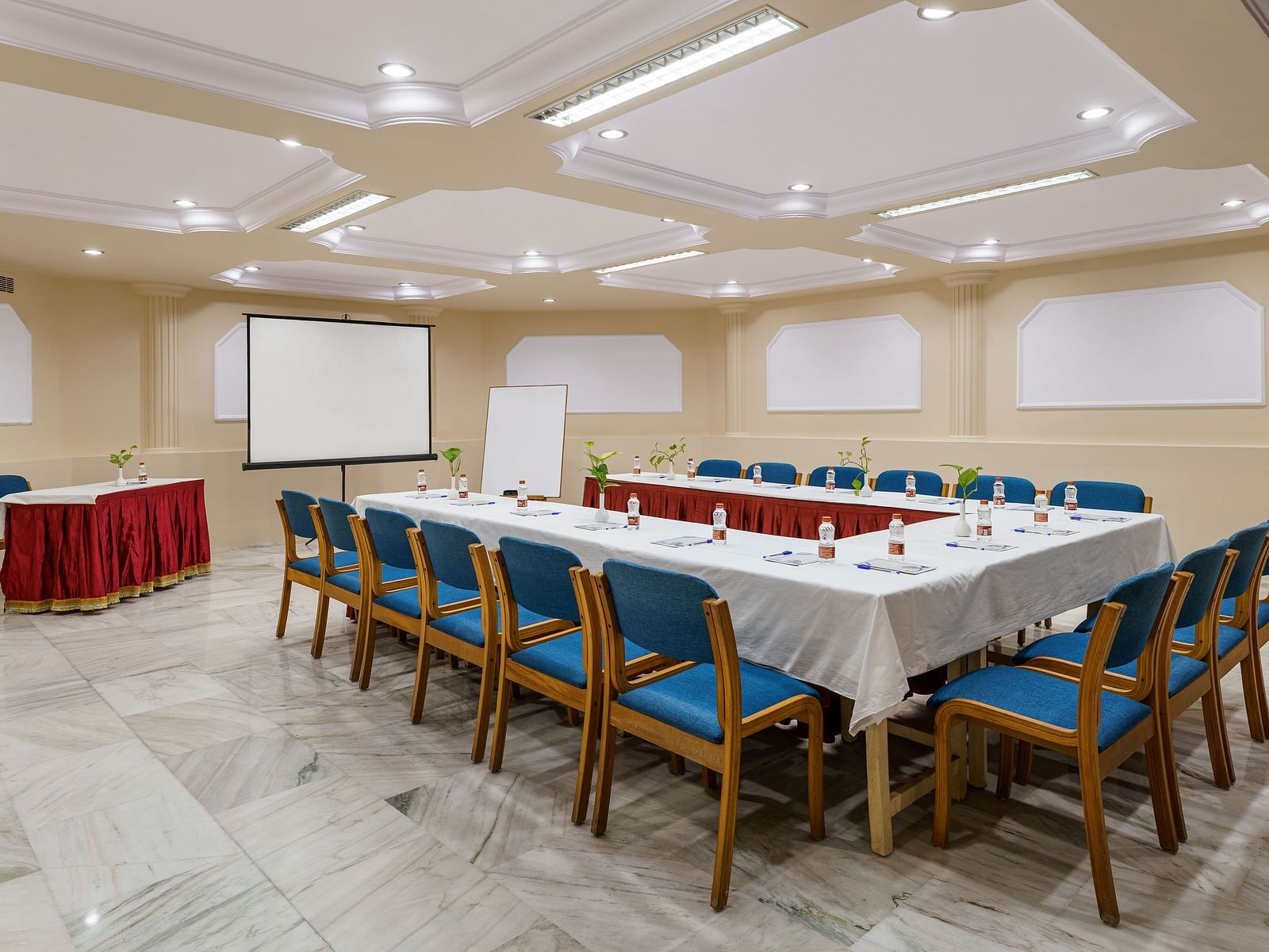 interior of a conference hall with a big table and chairs around it - Hotel Rajdarshan, Udaipur.