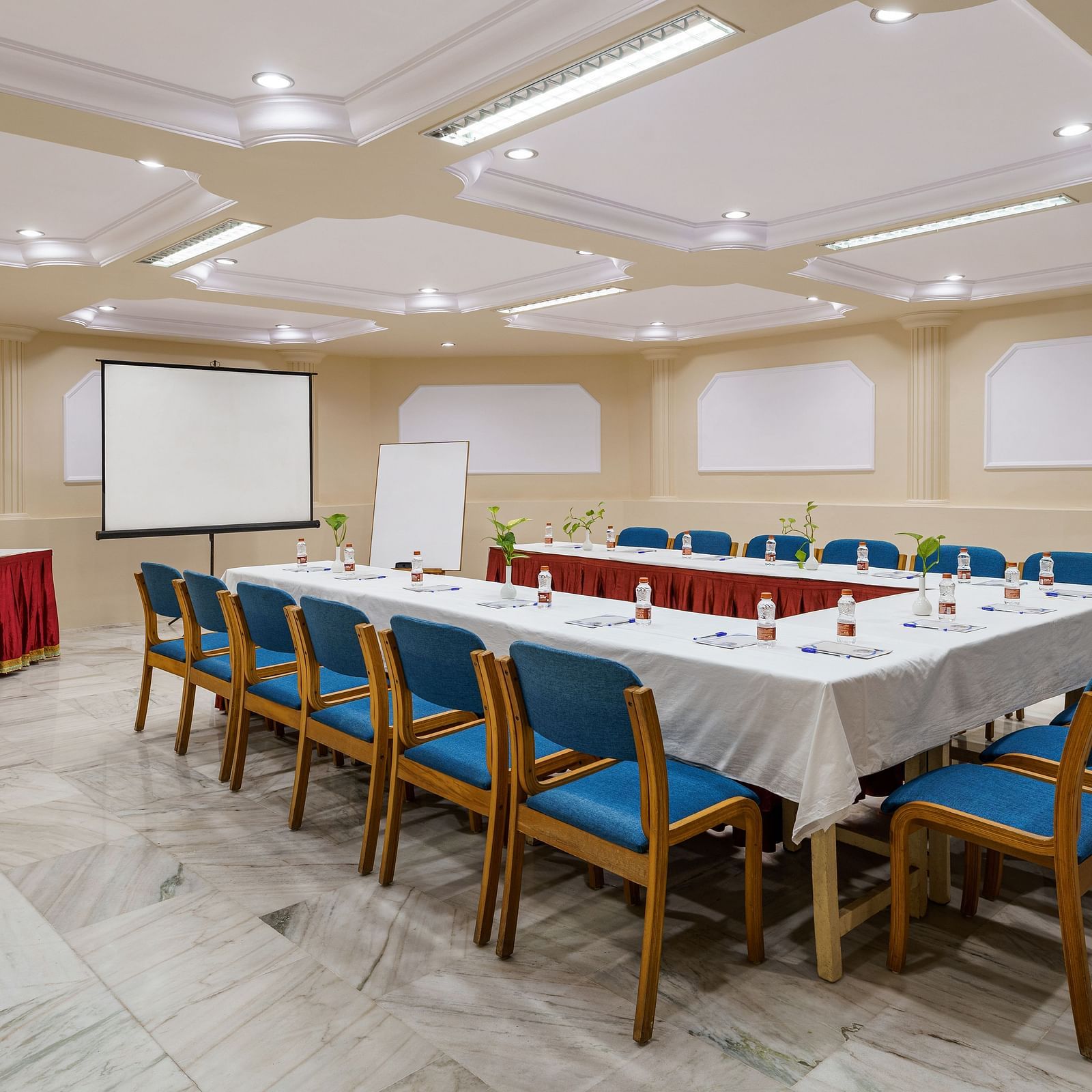 interior of a conference hall with a big table and chairs around it - Hotel Rajdarshan, Udaipur.