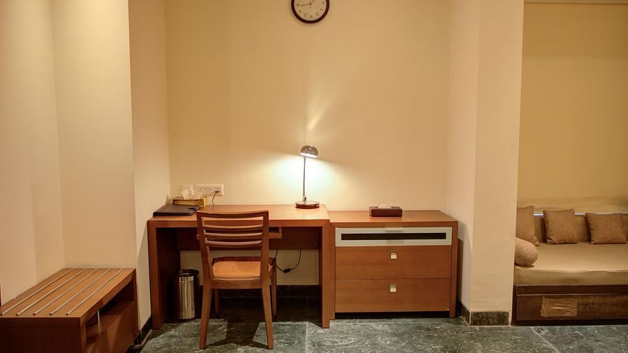 work desk with table lamp in bedroom