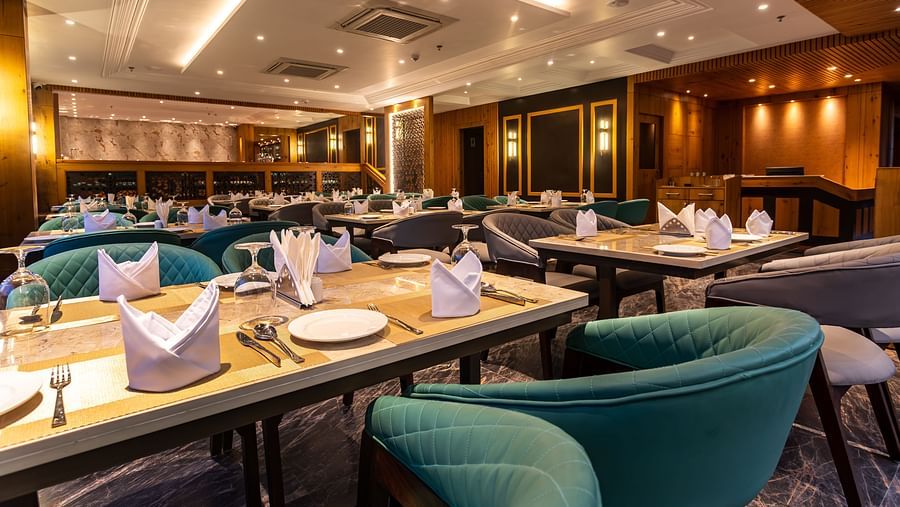 An image of a restaurant with seating arrangement and tables laid out with cutlery - The Belvedere Himalayan Retreat, McLeodganj