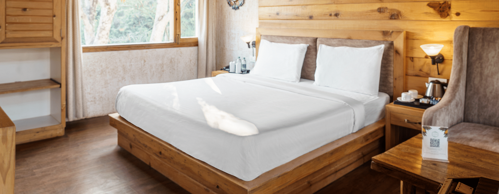 A view of the large bed at Pinewood Cottage at the Sylvan Retreat, Dehradun.