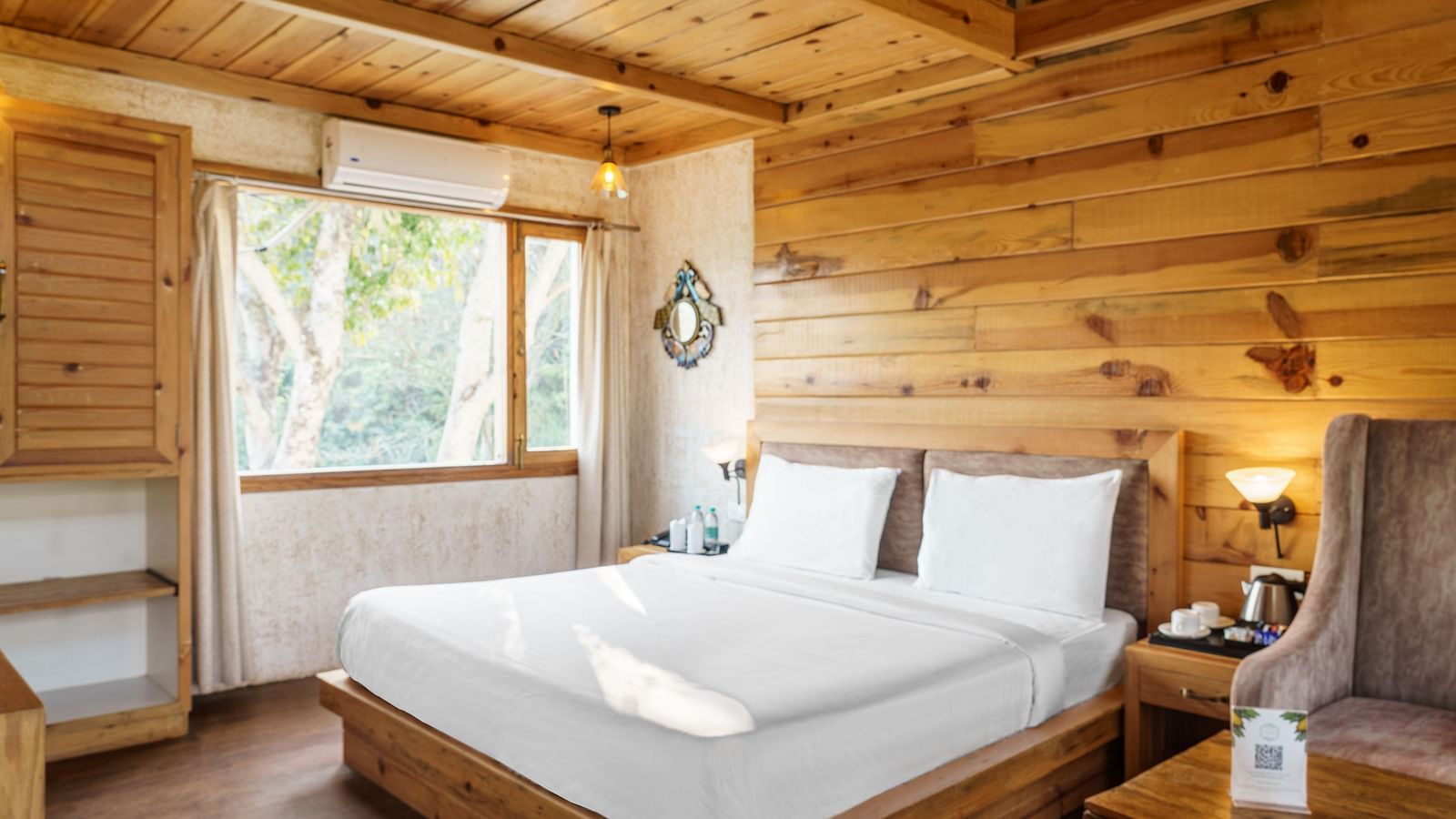 A view of the large bed at Pinewood Cottage at the Sylvan Retreat, Dehradun.