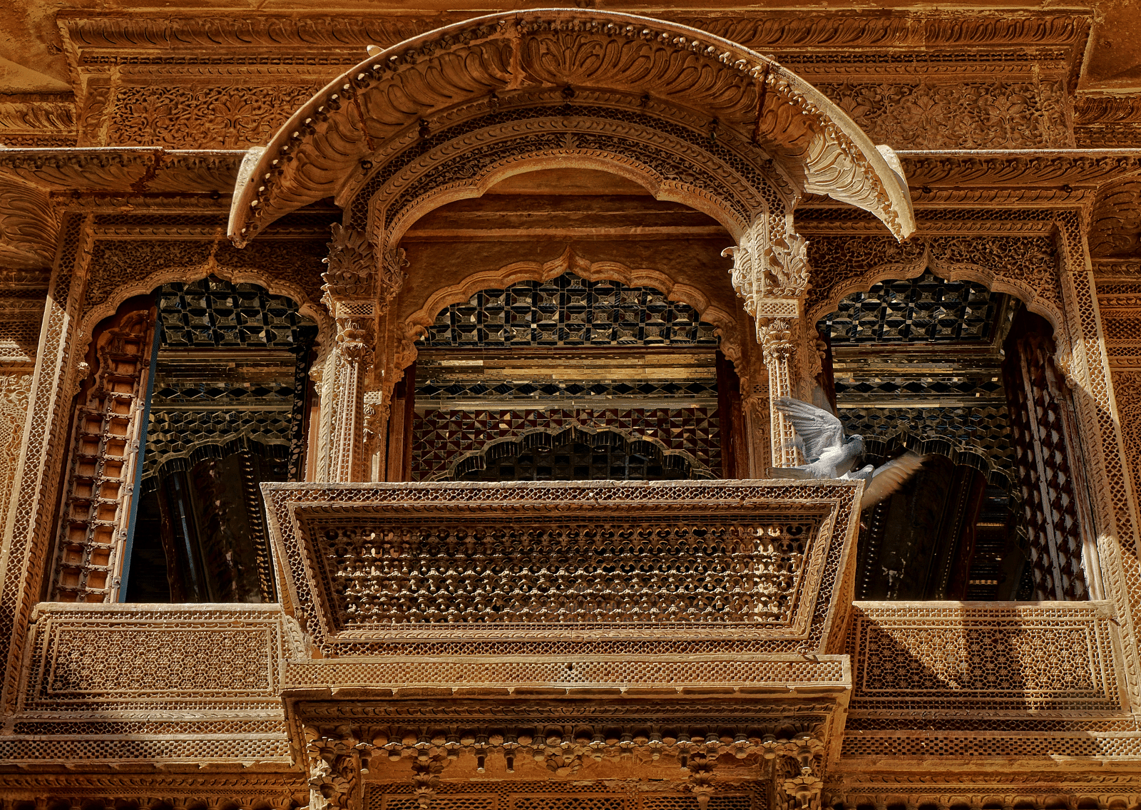 An overview of a balcony of an old haveli in Rajasthan with intricate detailing.