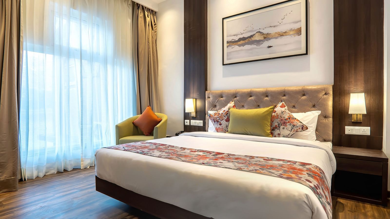 Deluxe Rooms with Lake View at Hotel Le ROI Lake View Koti captured with a cosy bed and window view1