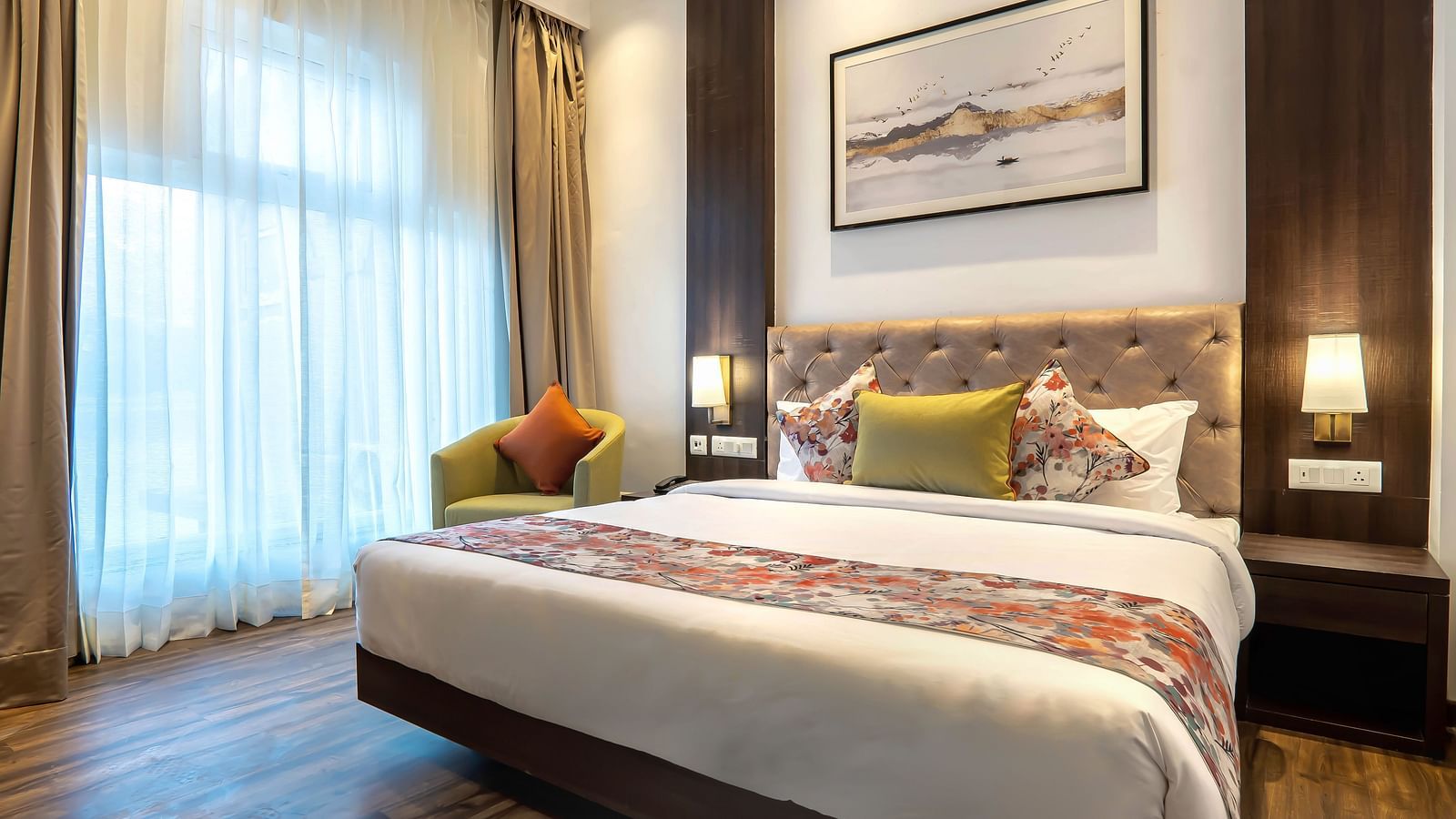 Deluxe Rooms with Lake View at Hotel Le ROI Lake View Koti captured with a cosy bed and window view1