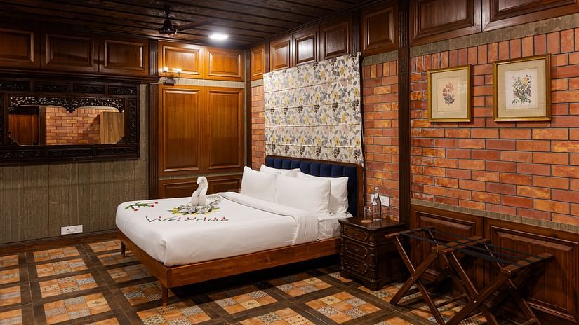An overview of a bedroom with a double bed inside Wildflower Villa - Karma Lakelands.