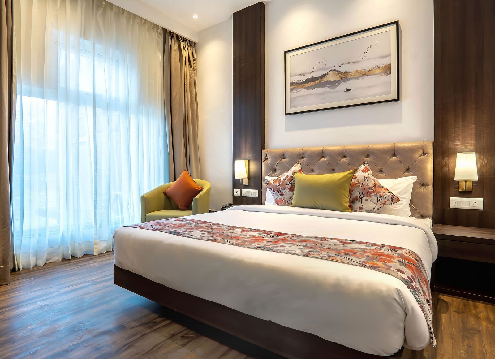 Deluxe Rooms with Lake View at Hotel Le ROI Lake View Koti captured with a cosy bed and window view1