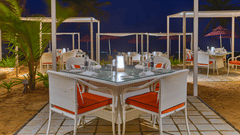 Outdoor tables at Azaya Beach Resort Goa, high on the list of recommended restaurants near Varca Beach.