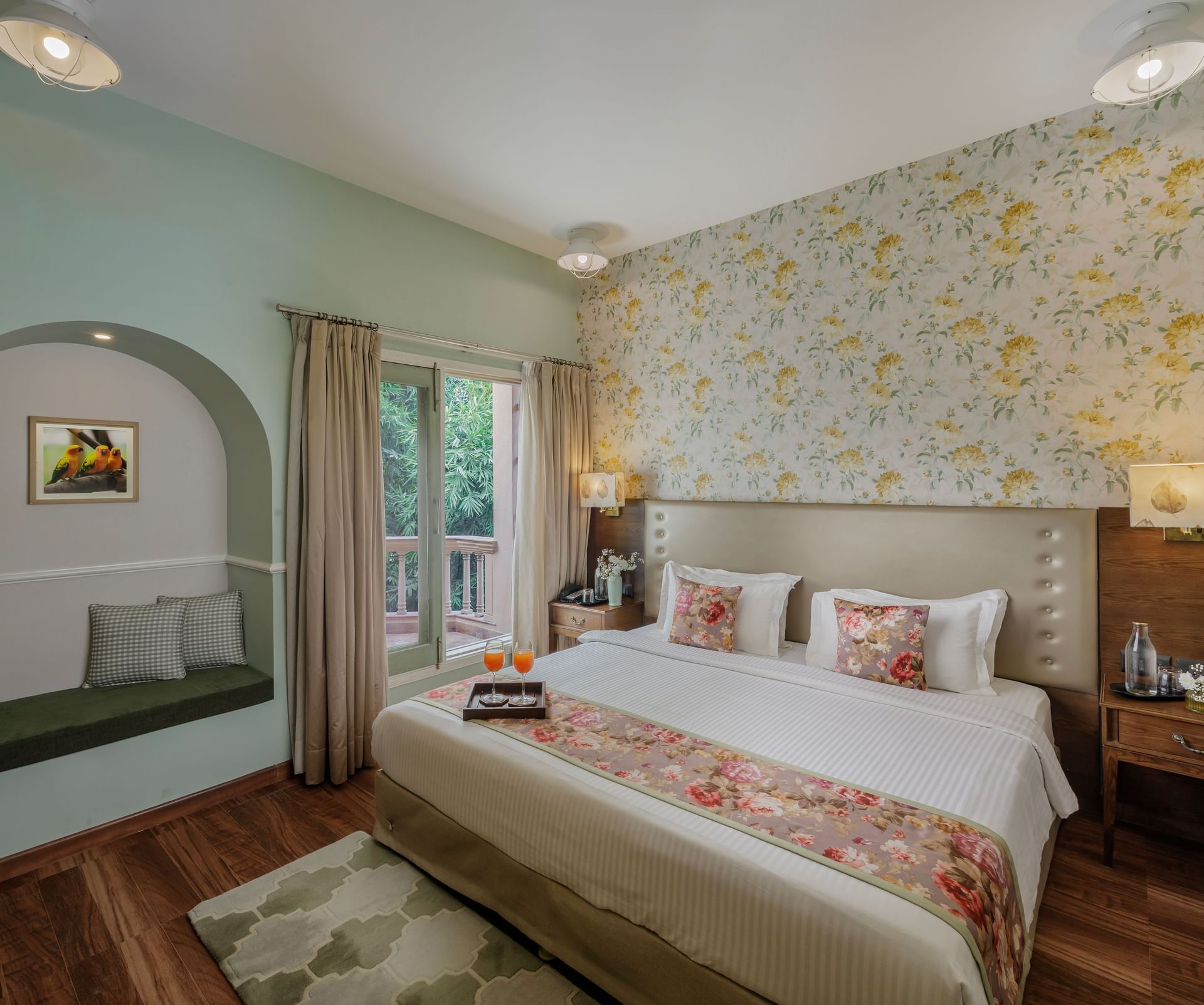 Spacious guest room with double bed, elegant décor, and warm tones at Karma Chalets.