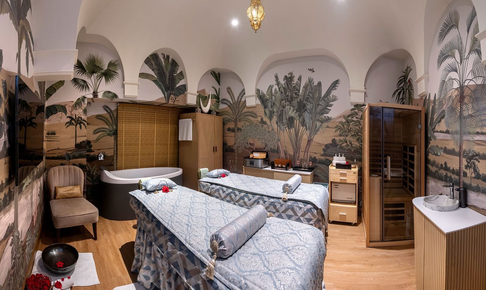 Image of a spa with beds and tropical theme decor at The Claridges New Delhi - Claridges Collection