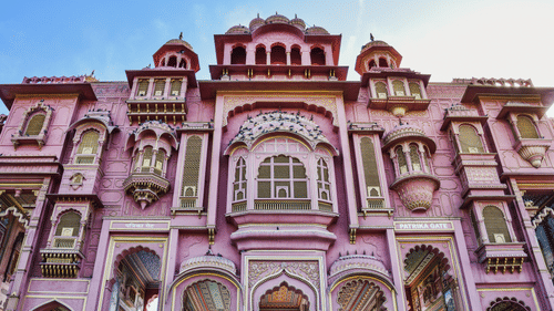 The grand facade of the Patrika Gate with a pink exterior serving as the entrance to the Jawahar Circle Garden.in Jaipur.
