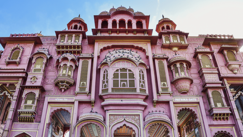 The grand facade of the Patrika Gate with a pink exterior serving as the entrance to the Jawahar Circle Garden.in Jaipur.