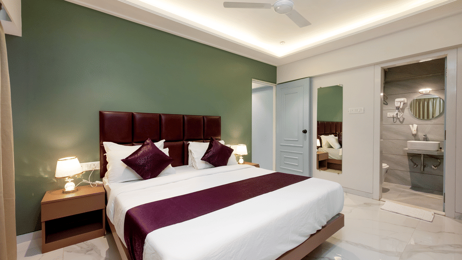 Modern king bedroom with elegant interiors at Home2 Residency, Mumbai Airport