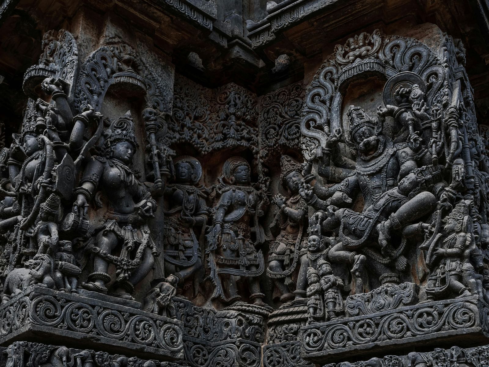 Close-up view of sculpted idols on the wall
