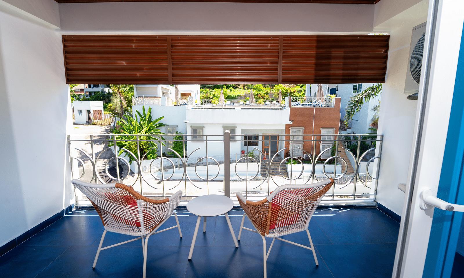 An image of a balcony offering the views of the garden below it - Hotel 39, Jamaica (Montego Bay)