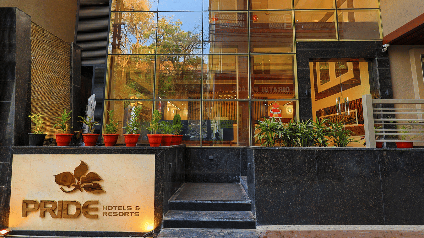 Facade of a property under Pride Hotels and Resorts with its name written at the entrance