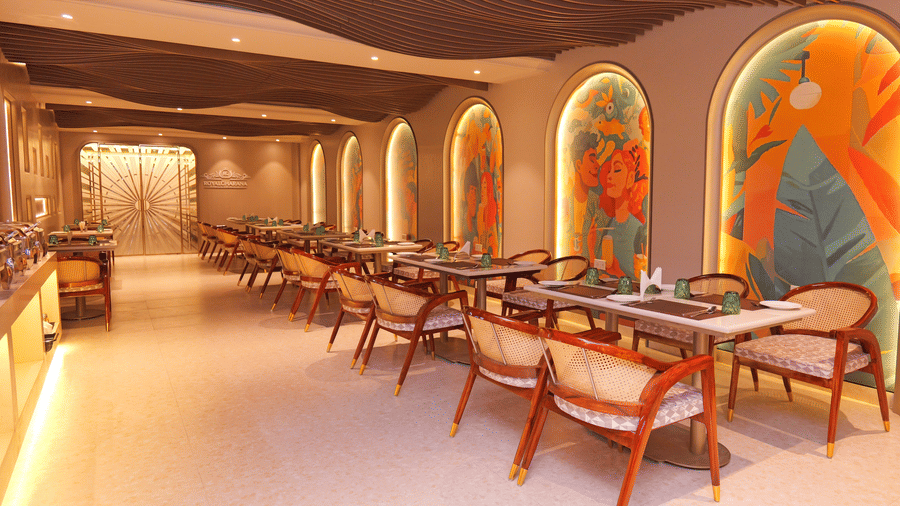Lounge seating area with wooden chairs, tables, and decorative wall panels at Nirvana Gateway.