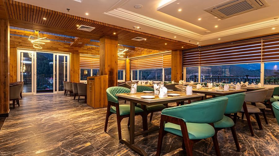 An image of a restaurant with seating arrangement and tables laid out with cutlery - The Belvedere Himalayan Retreat, McLeodganj
