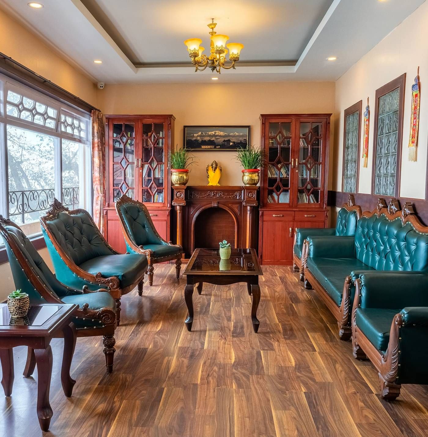 Multiple chairs and a coffee table placed in a room with a glass window | Summit Oakden Resort & Spa, Mall Road