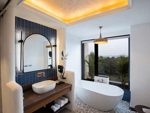 A side view of modern bathroom with a freestanding bathtub at The Sierra