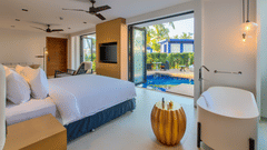 Bedroom in one of the villas in South Goa with private pool at Azaya Beach Resort Goa, overlooking the water.