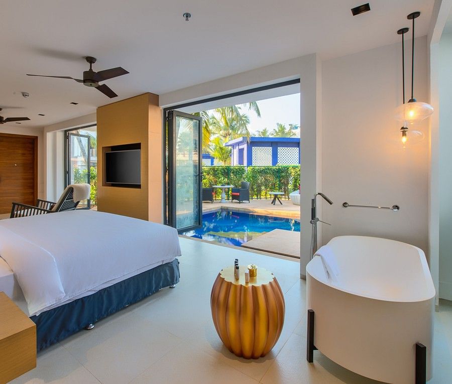 alt-text Room with private pool in Goa decorated with gold and white interiors