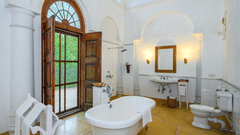 An overview of the bathroom with a tub inside Maharaja Sahib Singh room - The Baradari Palace