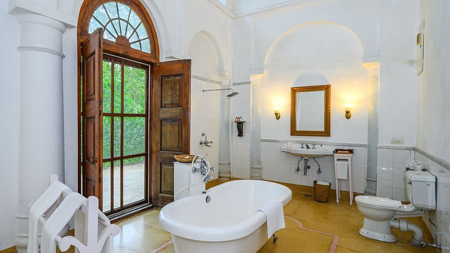 An overview of the bathroom with a tub inside Maharaja Sahib Singh room - The Baradari Palace