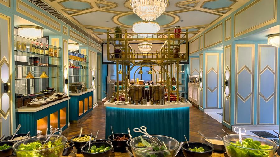 a full view image of the lutyens deli multi cuisine restaurant with salad bowl at the forefront - 